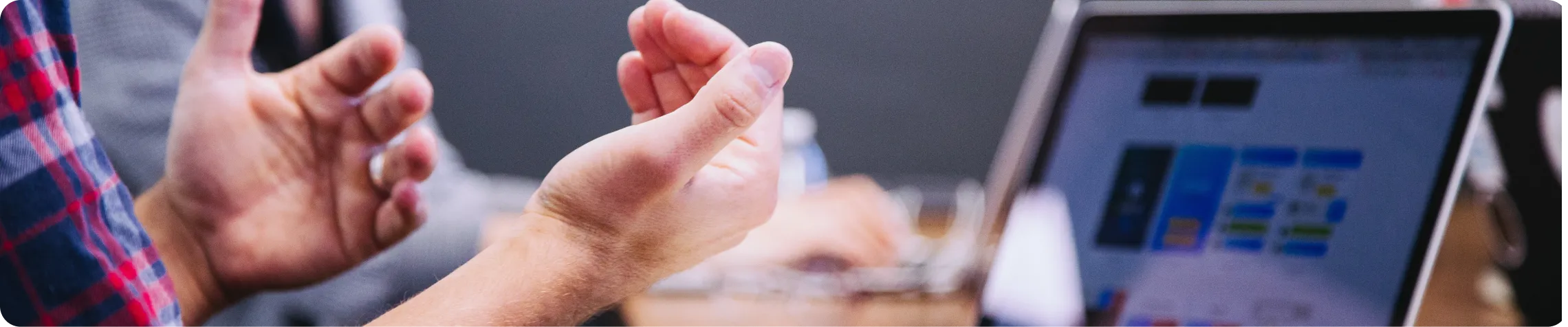 Hands typing on a computer